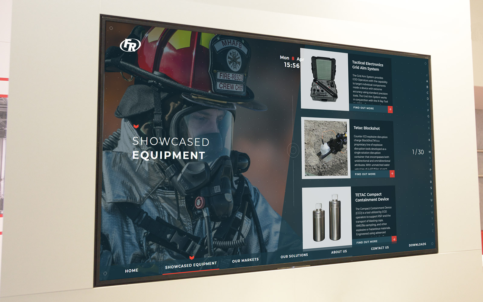 Large monitor displaying Federal Resources interactive display software showcasing equipment on white office wall