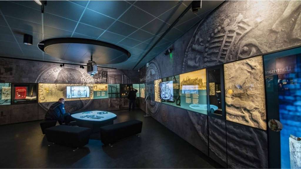 Royal Mint interactive digital software displayed using several large monitors across coin decorated walls