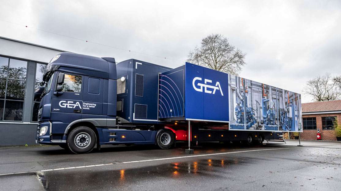a large exhibition truck parked outside a tradeshow with touchscreen experiences inside for GEA